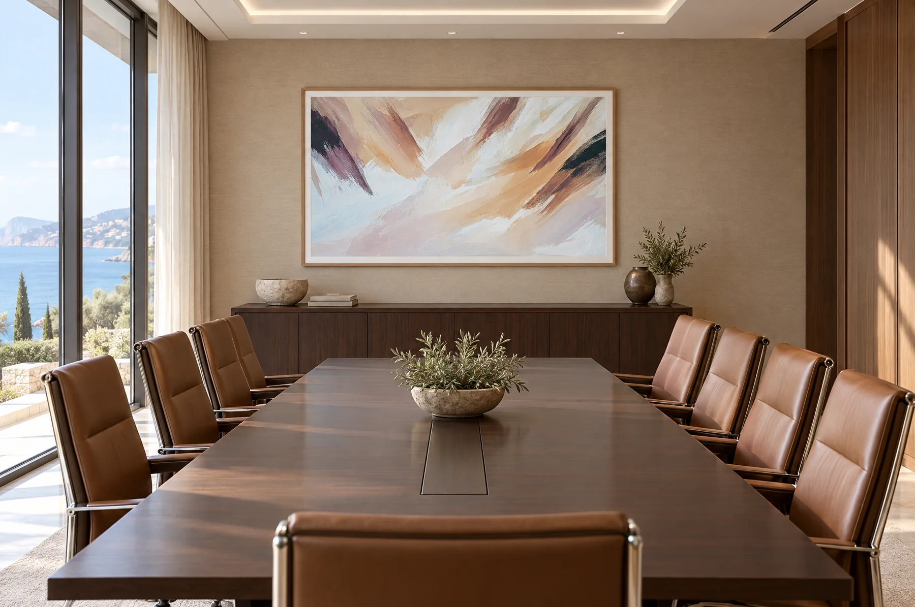A large framed brushstroke landscape artwork on the end wall of a boardroom